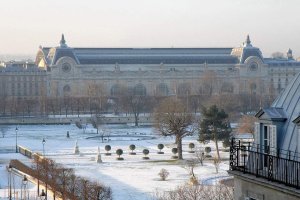 snow-covered Tuileries Garden with Musee d'Orsay in background