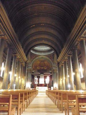 Interior view of Église Saint-Pothin church in Lyon showing nave and altar