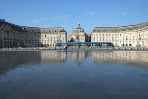 Elegant Place de la Bourse square with reflective water mirror in Bordeaux