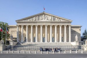 Front view of Palais Bourbon façade with classical columns in Paris