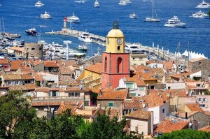 General view of Notre-Dame-de-l'Assomption church with nearby lighthouse in Saint-Tropez