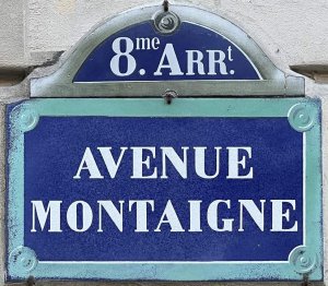 Street name plaque displaying Avenue Montaigne in Paris