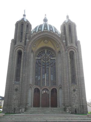 Main façade of Basilique Sainte-Clotilde in Reims with gothic architectural details
