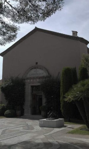Interior view of Chapelle Notre-Dame de l'Annonciade in Saint-Tropez featuring exhibited artworks