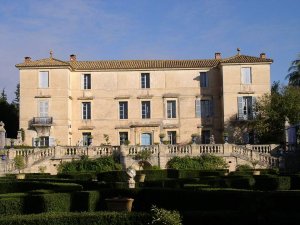Exterior view of Château de Flaugergues in Montpellier surrounded by greenery