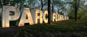 Main entrance gate of Parc Floral de Paris with surrounding greenery