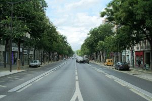 Street view of boulevard de Magenta in Paris with buildings and vehicles