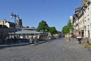 Barricaded shop windows with wooden panels in Place des Lices, Rennes