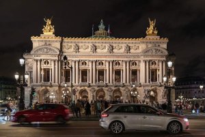 Palais Garnier opera house illuminated at night in Paris