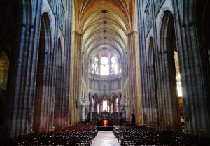 Nave interior of Auxerre Cathedral Saint Stephen with stone arches and columns