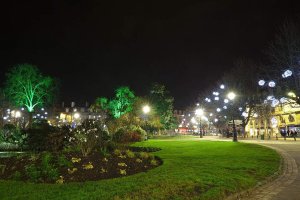 Place Gambetta illuminated at night showing the city square with street lights and buildings