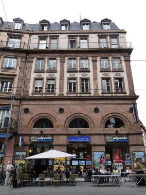 Facade of Cinema Odyssée at 3 rue des Francs-Bourgeois in Strasbourg with Le Cosmos signage