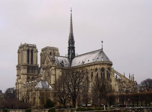 Rear view of Notre-Dame de Paris cathedral covered in snow seen from Pont de l'Archevêché