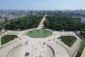 Grande Roue de Paris with the Louvre palace and Tuileries Gardens in the background