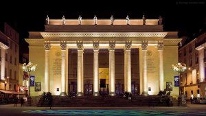 Nighttime view of Théâtre Graslin illuminated at Place Graslin