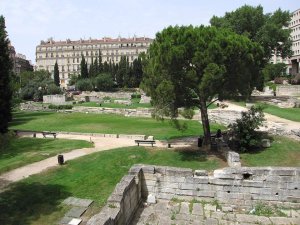 The archaeological garden of Jardin des Vestiges in Marseille showing ancient ruins and greenery