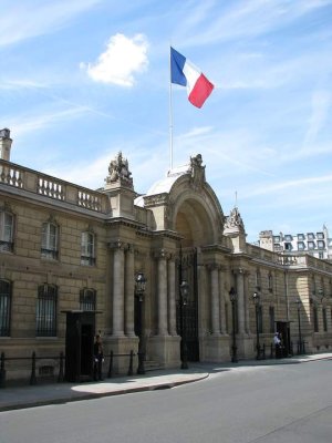 Entrance of the Élysée Palace showing ornate doors and classical facade in Paris
