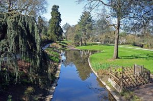 Lush green park with walking pathways and trees in Parc de Procé, Nantes