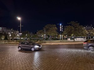 Nighttime view of Place d'Italie in Paris illuminated by streetlights