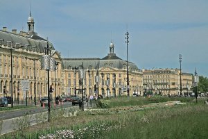 Historic Place de la Bourse square in Bordeaux with classical buildings reflecting on water