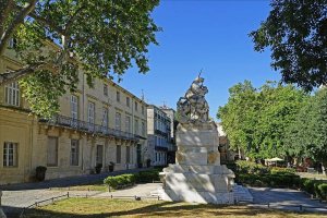 Garden at Place de la Canourgue with the Hotel de Belleval on the left and the Unicorn fountain in the foreground