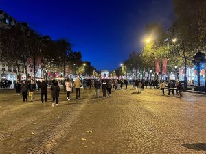 nighttime cityscape of avenue des champs-elysees in paris with illuminated buildings and streetlights