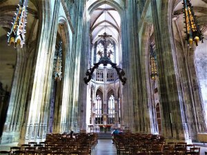 Gothic interior view of Church of Saint-Maclou in Rouen showing arches and stained glass windows