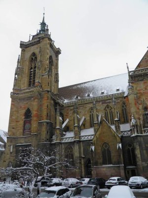St Martin's Church in Colmar viewed from outside during winter with snow