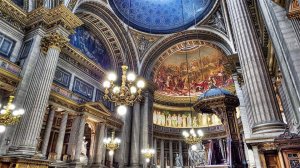 Interior view of La Madeleine church in Paris showing grand altar and tall columns