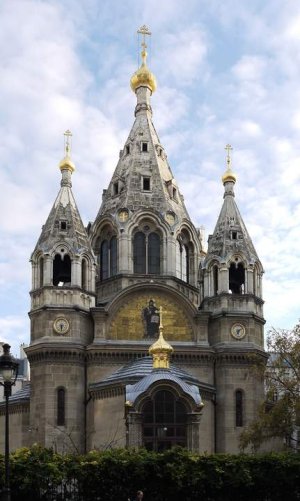 Facade of Alexander Nevsky Cathedral Orthodox church in Paris with ornate domes and crosses