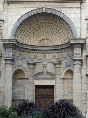 West entrance portal of Saint-Nizier Church in Lyon featuring detailed stone carvings