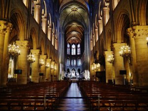 Nave interior of Notre-Dame Cathedral in Paris showing arches and columns