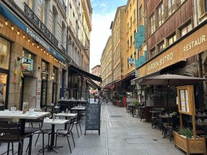 Street view of Rue Mercière in Lyon with buildings and pedestrians