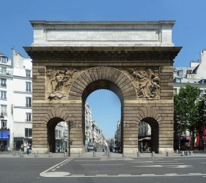 Porte Saint-Martin archway seen from rue Saint-Martin in Paris