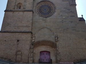 Exterior entrance of Cathédrale Saint-Michel de Carcassonne showing gothic architectural details