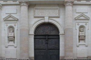 Main entrance door of Église Sainte-Croix church in Nantes featuring detailed architectural elements