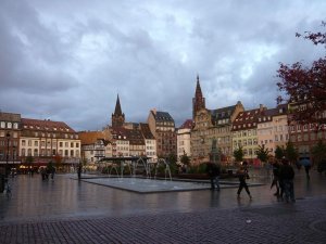 Place Kléber urban square with wet pavement and overcast sky