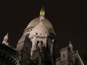Sacré-Cœur Basilica illuminated at night in Montmartre Paris