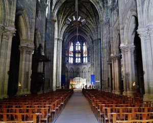 Nave interior of Saint-Louis-des-Chartrons Church with arches and wooden pews