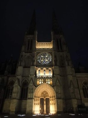 Nighttime illuminated facade of Bordeaux Cathedral
