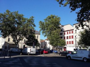 View of Place Saint-Louis square in Lyon with surrounding historic buildings