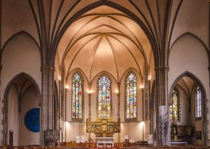 Neo-gothic interior of Saint-Maurice Church in Strasbourg with ornate arches and historic design