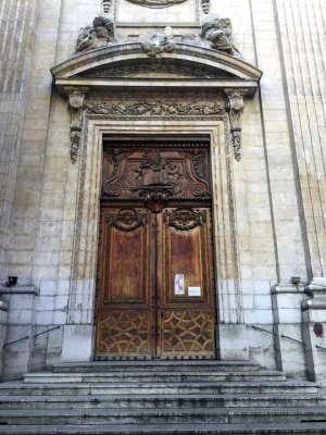 Ornate entrance doors of Saint-Polycarpe Church in Lyon