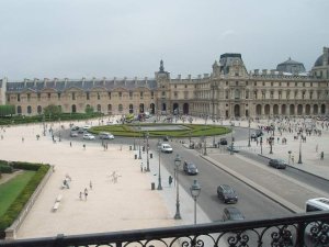 view of Place du Carrousel with Louvre Museum in background