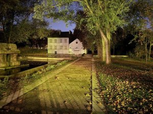 Nighttime view of Parc de Bercy in Paris illuminated with city lights