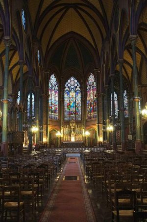 Interior view of Saint-Eugène-Sainte-Cécile Church with architectural details and lighting