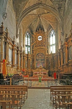 Gothic interior of Saint Pierre Parish church in Avignon with pointed arches and stained glass windows