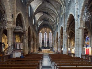 Interior view of Saint-Bonaventure Basilica showing architectural details and seating