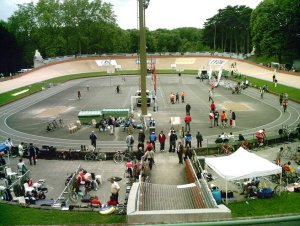 Interior view of Vélodrome Georges-Préveral with cyclists racing on the track during competition