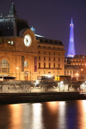 Nighttime view of the Musée d'Orsay illuminated from the Quai des Tuileries in Paris